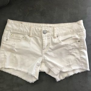 AE distressed white shorts mid rise